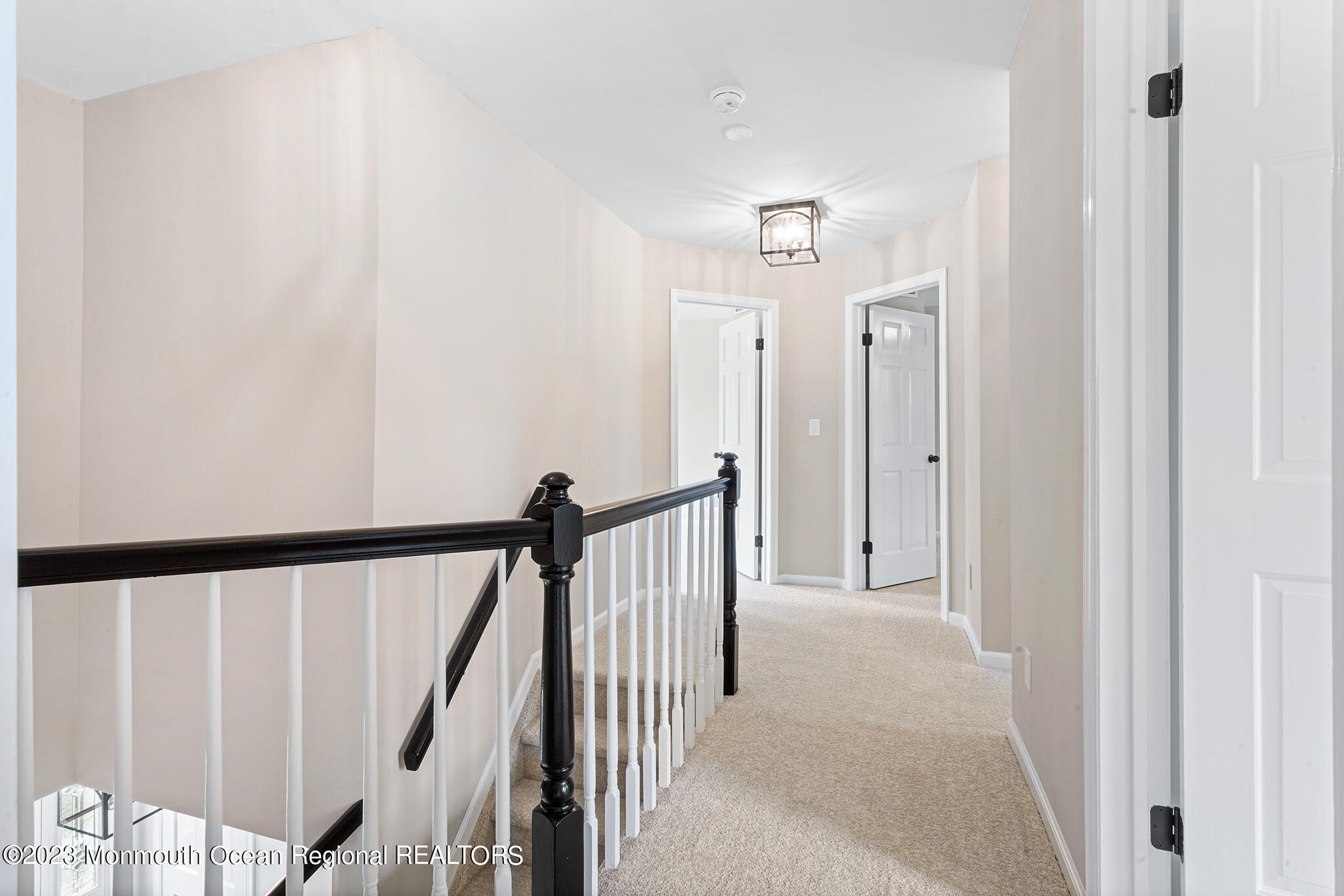 4360 Old Bridge Matawan Road Matawan, NJ 07747 - Photo 26 of 46 a view of a hallway with wooden floor and staircase