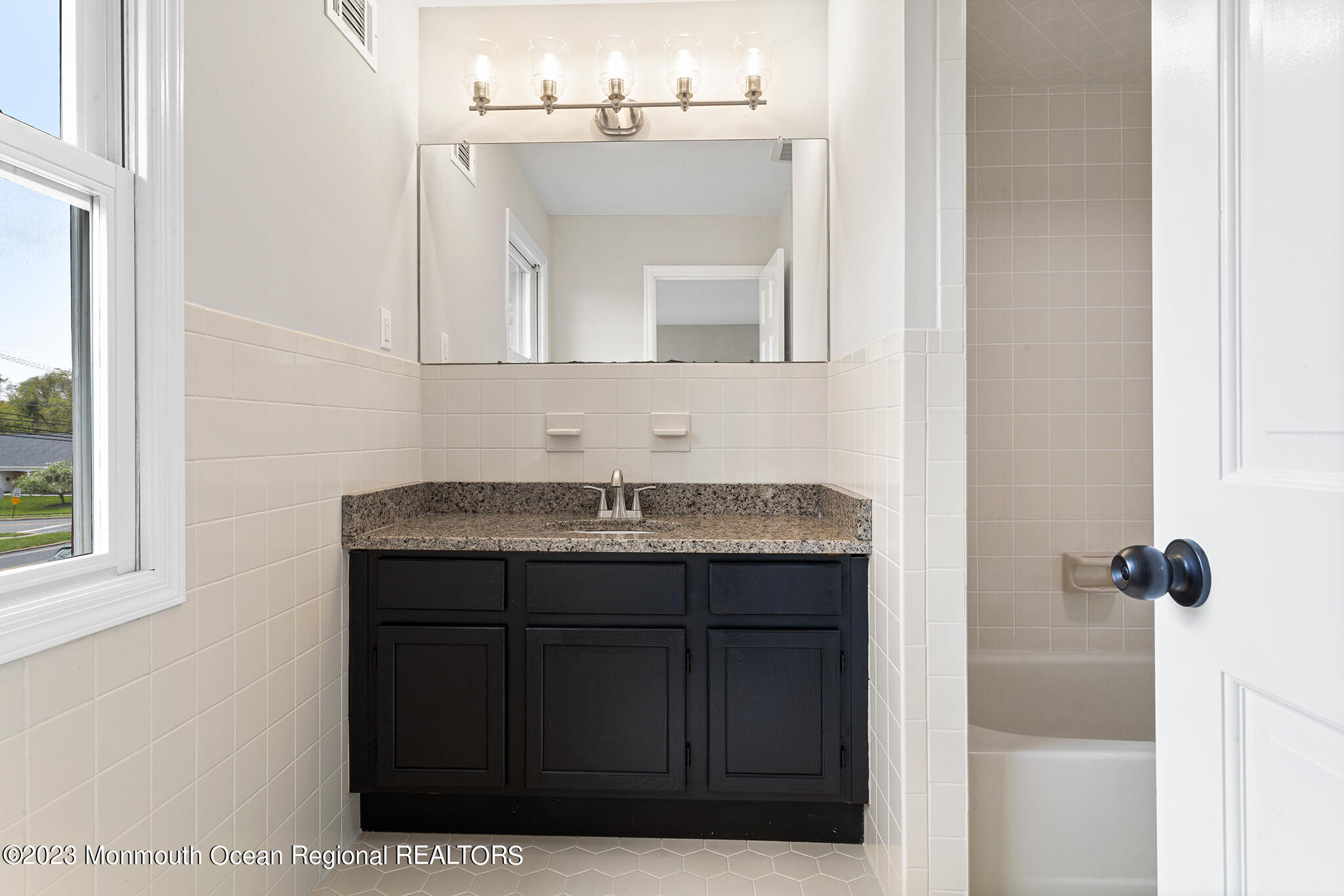 4360 Old Bridge Matawan Road Matawan, NJ 07747 - Photo 32 of 46 a bathroom with a sink and a mirror