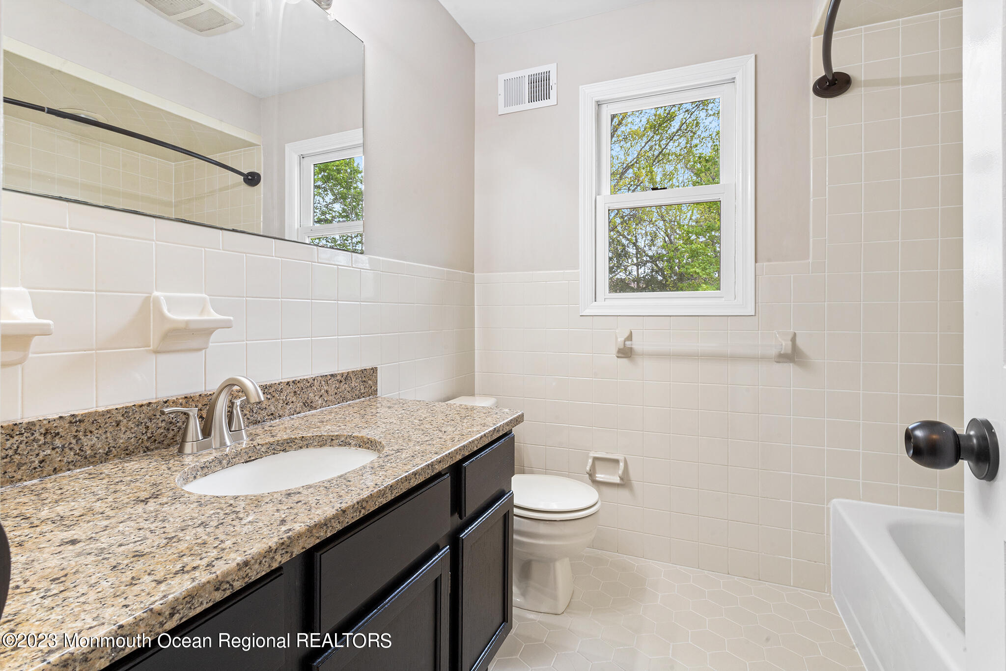 4360 Old Bridge Matawan Road Matawan, NJ 07747 - Photo 42 of 46 a bathroom with a granite countertop sink a toilet and a bathtub
