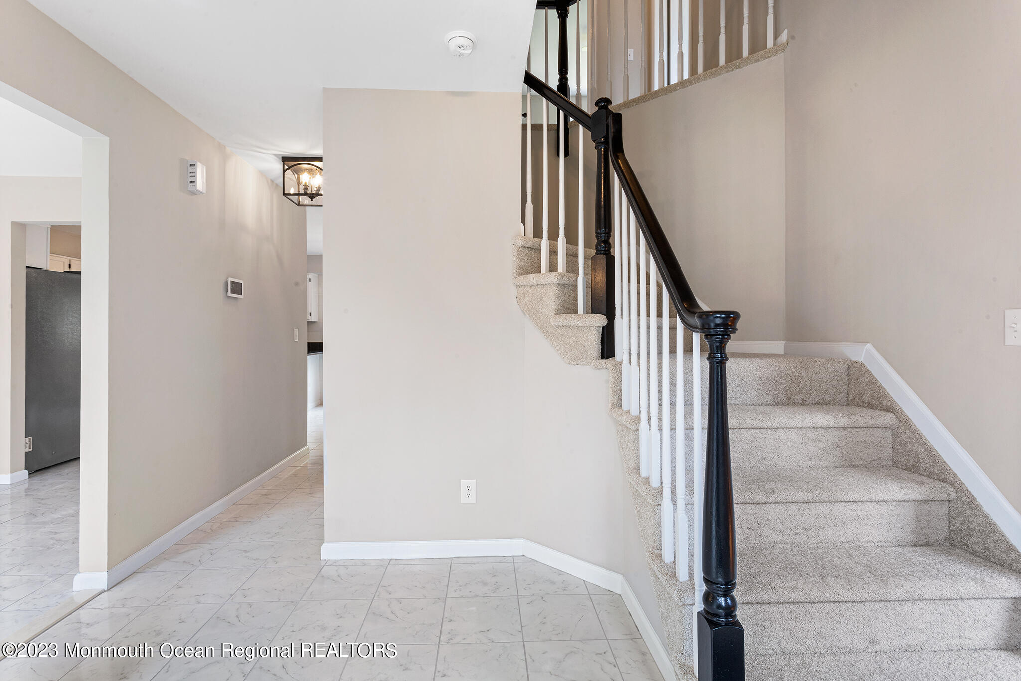 4360 Old Bridge Matawan Road Matawan, NJ 07747 - Photo 5 of 46 a view of staircase with white walls and railing