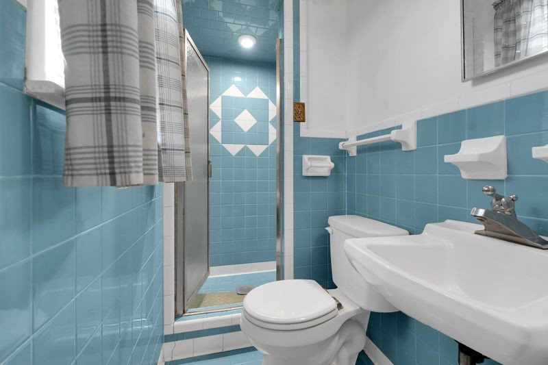 151 Robert Branch Drive Tullahoma, TN 37388 - Photo 16 of 18 a white toilet sitting next to a bathroom sink