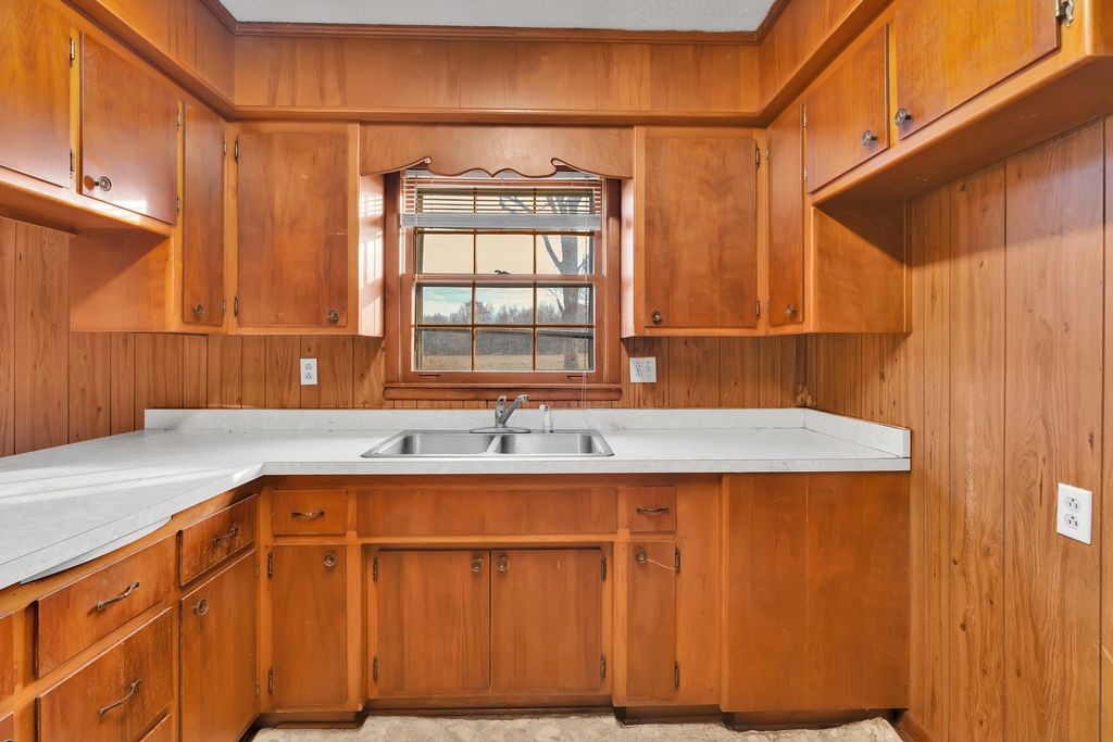 151 Robert Branch Drive Tullahoma, TN 37388 - Photo 9 of 18 a kitchen with a sink a cabinets and window