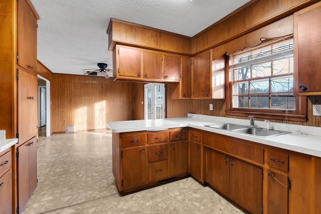 151 Robert Branch Drive Tullahoma, TN 37388 - Photo 10 of 18 a kitchen with a sink and cabinets
