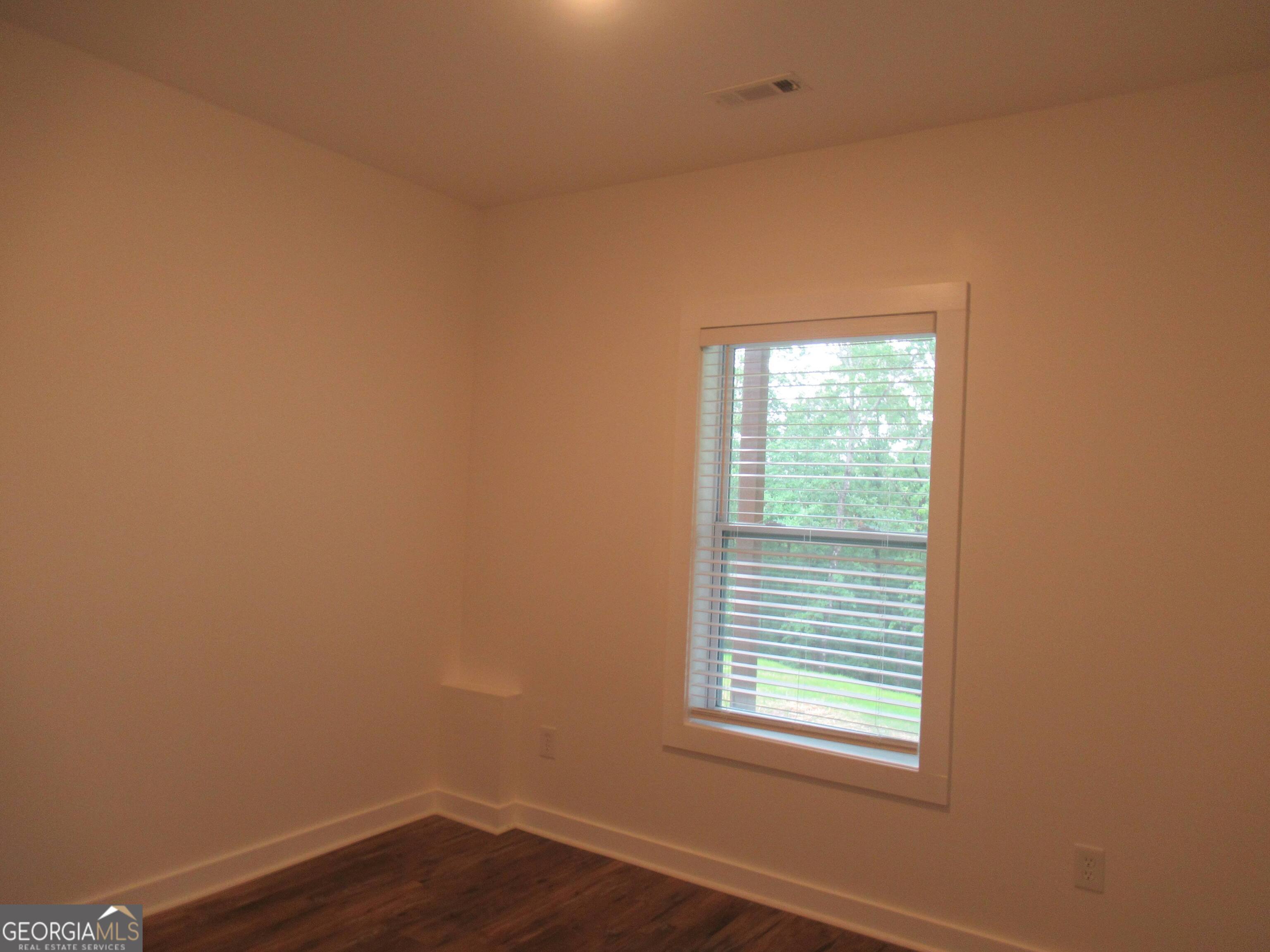 765 Old Kerns Road Dawsonville, GA 30534 - Photo 36 of 36 a view of a small space with wooden floor and a window