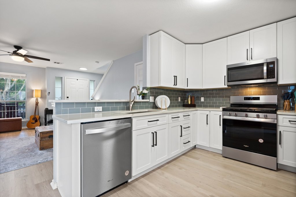 173 Decker Kyle, TX 78640 - Photo 11 of 37 Remodeled Open Concept Kitchen looking into the large spacious living room.