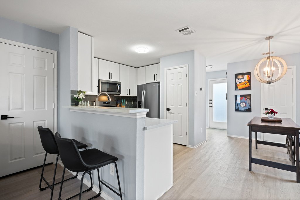 173 Decker Kyle, TX 78640 - Photo 12 of 37 Remodeled Open Concept Kitchen looking into the large spacious living room.