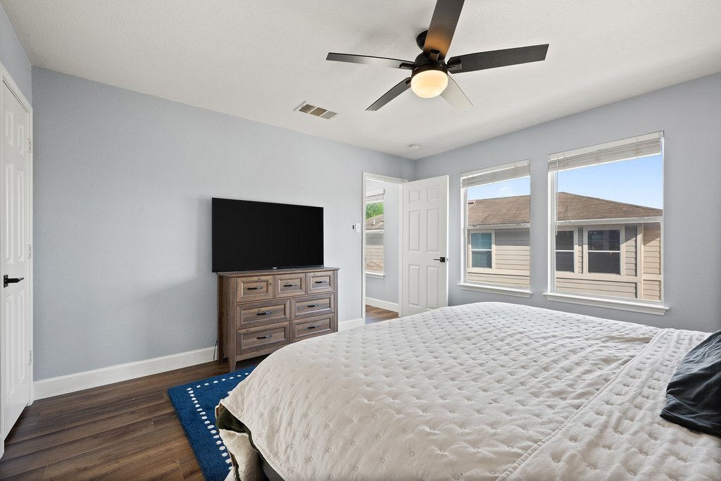 173 Decker Kyle, TX 78640 - Photo 16 of 37 Bedroom featuring dark wood-type flooring and ceiling fan