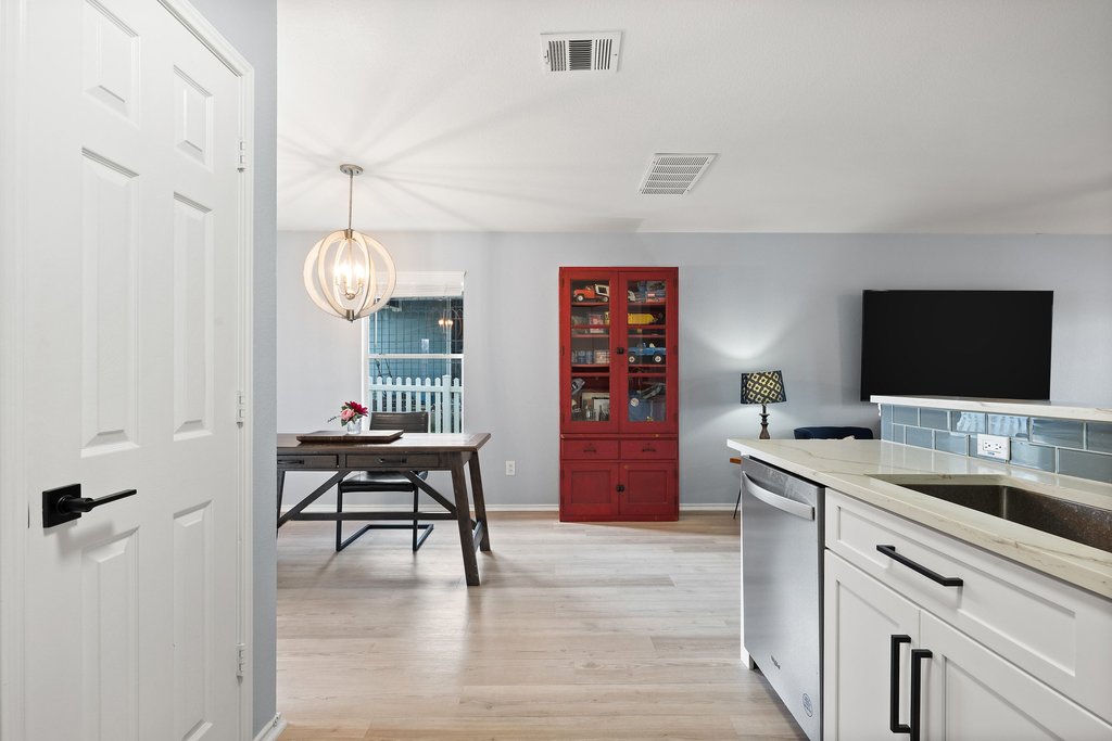 173 Decker Kyle, TX 78640 - Photo 10 of 37 Remodeled Open Concept Kitchen looking into the large spacious living room.