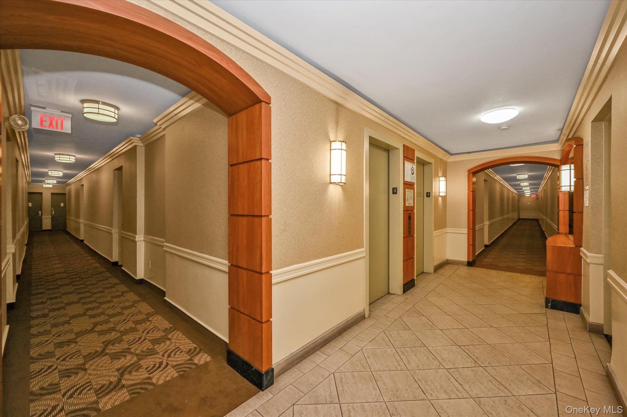 59-30 108th Street, Unit 4P Queens, NY 11368 - Photo 16 of 18 a view of a hallway with wooden floor and staircase