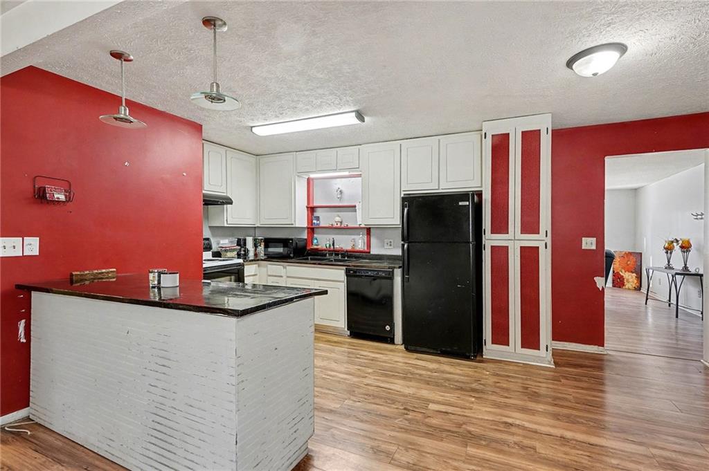 146 Mt Bethel Road McDonough, GA 30252 - Photo 14 of 32 a kitchen with stainless steel appliances granite countertop a refrigerator a sink dishwasher a stove and a refrigerator
