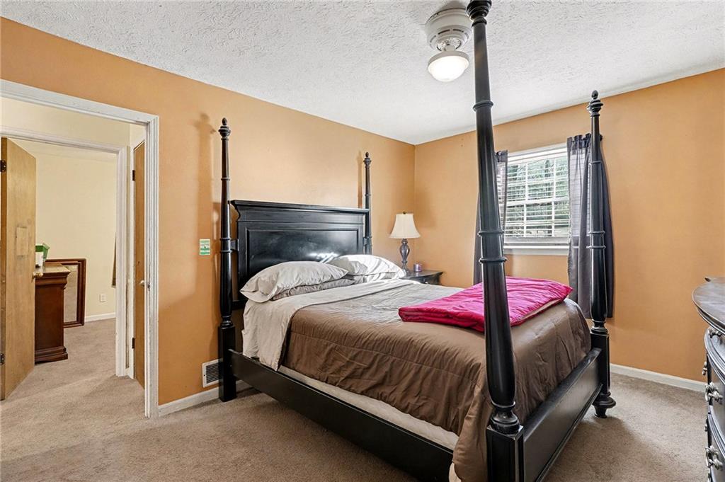 146 Mt Bethel Road McDonough, GA 30252 - Photo 16 of 32 a bedroom with a bed and a window