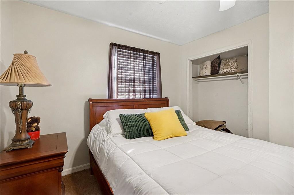 146 Mt Bethel Road McDonough, GA 30252 - Photo 23 of 32 a bedroom with a bed and a dresser