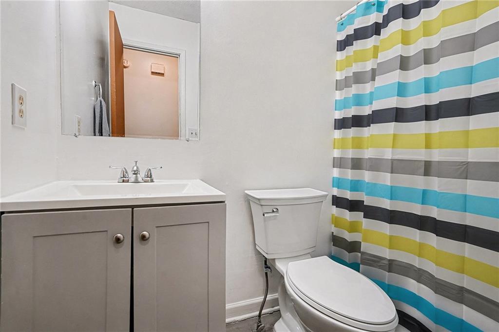 146 Mt Bethel Road McDonough, GA 30252 - Photo 26 of 32 a bathroom with a sink toilet and shower