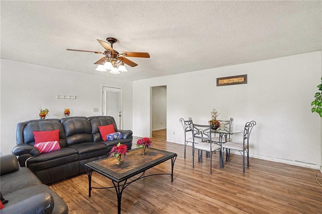 146 Mt Bethel Road McDonough, GA 30252 - Photo 9 of 32 a living room with furniture and wooden floor