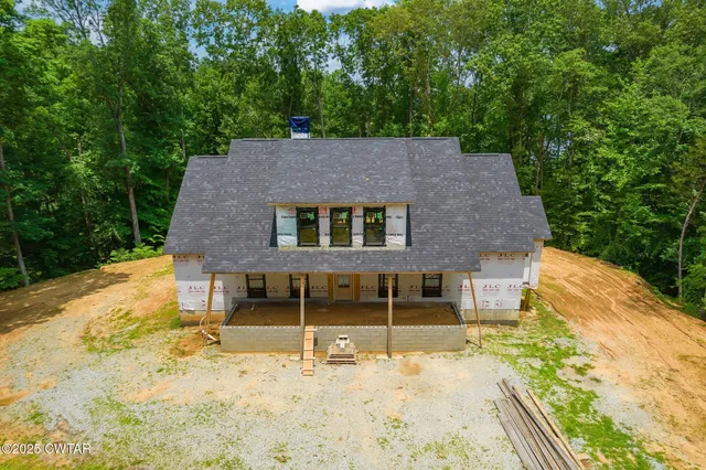 a backyard of a house with a yard and garage