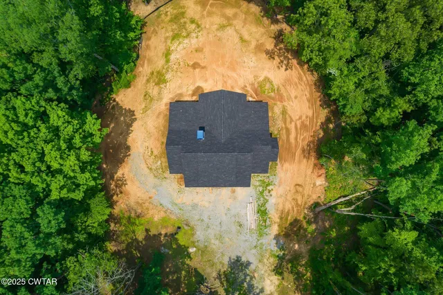 an aerial view of houses with yard