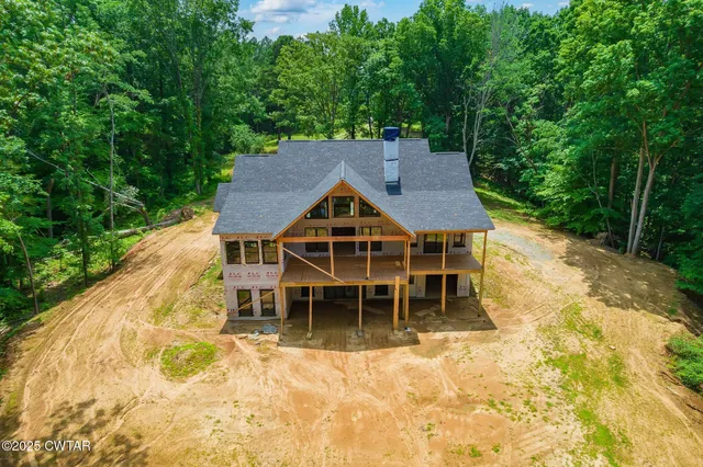 a house with a trees in the background