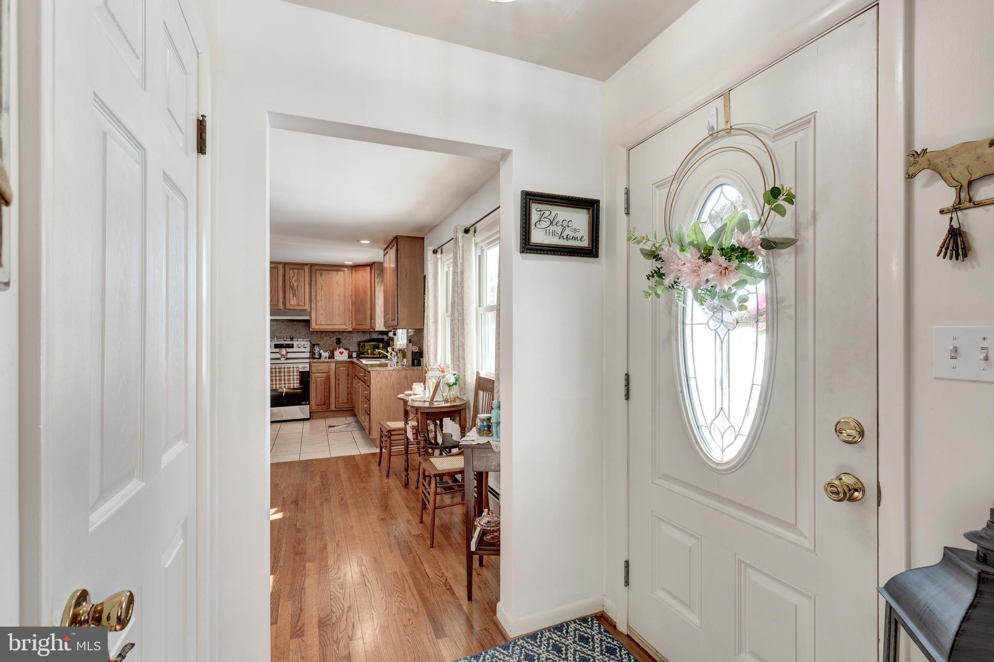 3820 Kump Station Road Taneytown, MD 21787 - Photo 11 of 59 a view of a livingroom with furniture wooden floor mirror and window