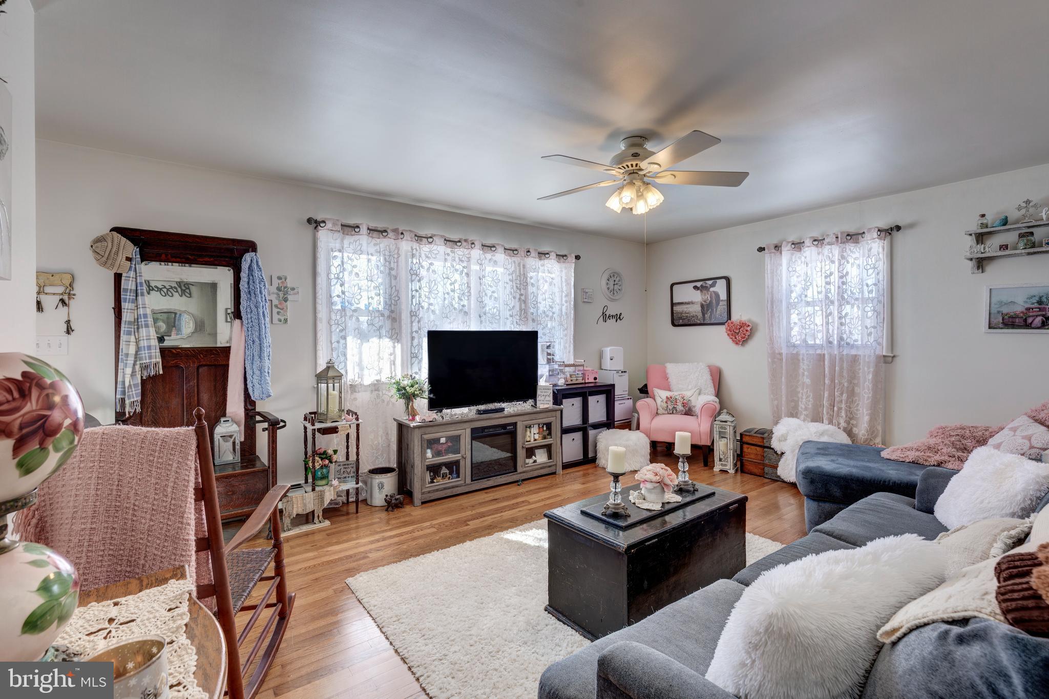 3820 Kump Station Road Taneytown, MD 21787 - Photo 14 of 59 a living room with furniture and a flat screen tv