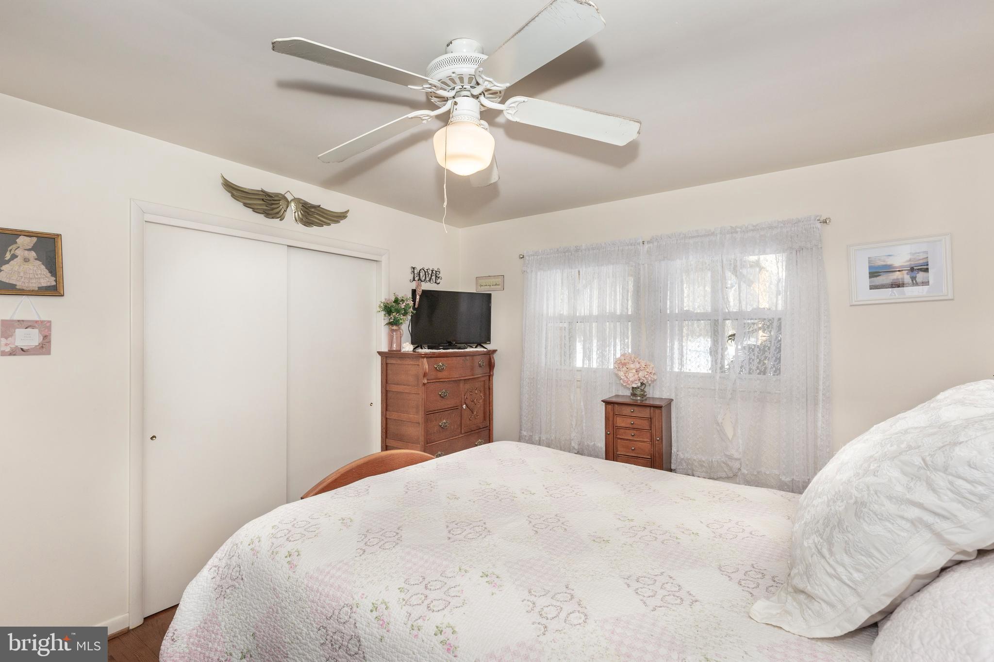 3820 Kump Station Road Taneytown, MD 21787 - Photo 17 of 59 a bedroom with a bed and a tv