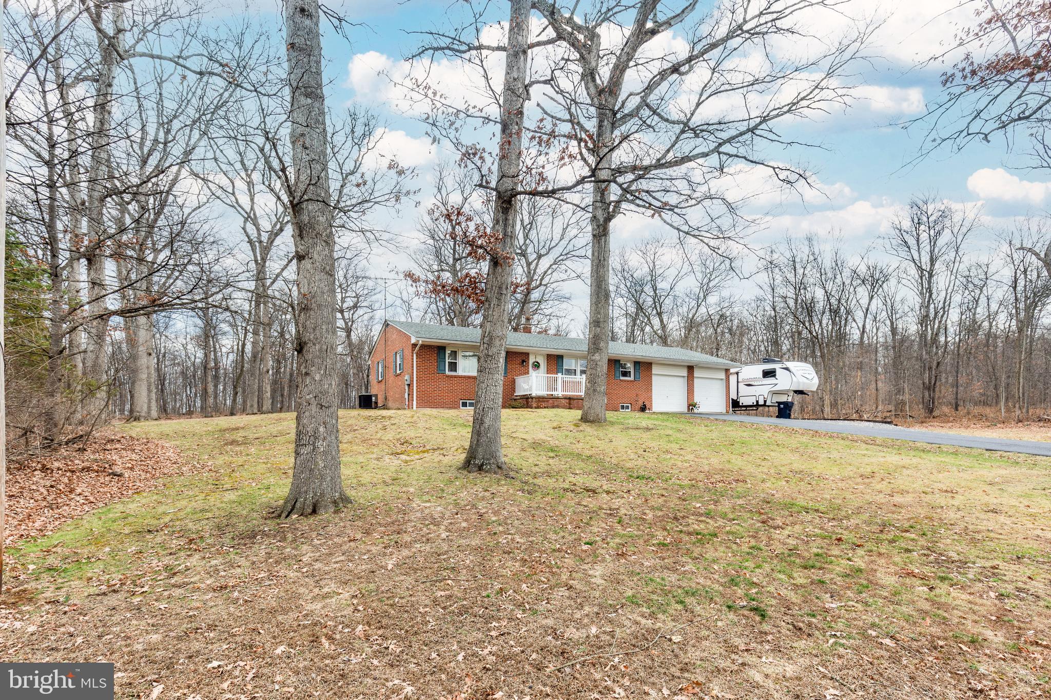 3820 Kump Station Road Taneytown, MD 21787 - Photo 2 of 59 a house that has a tree in front of it