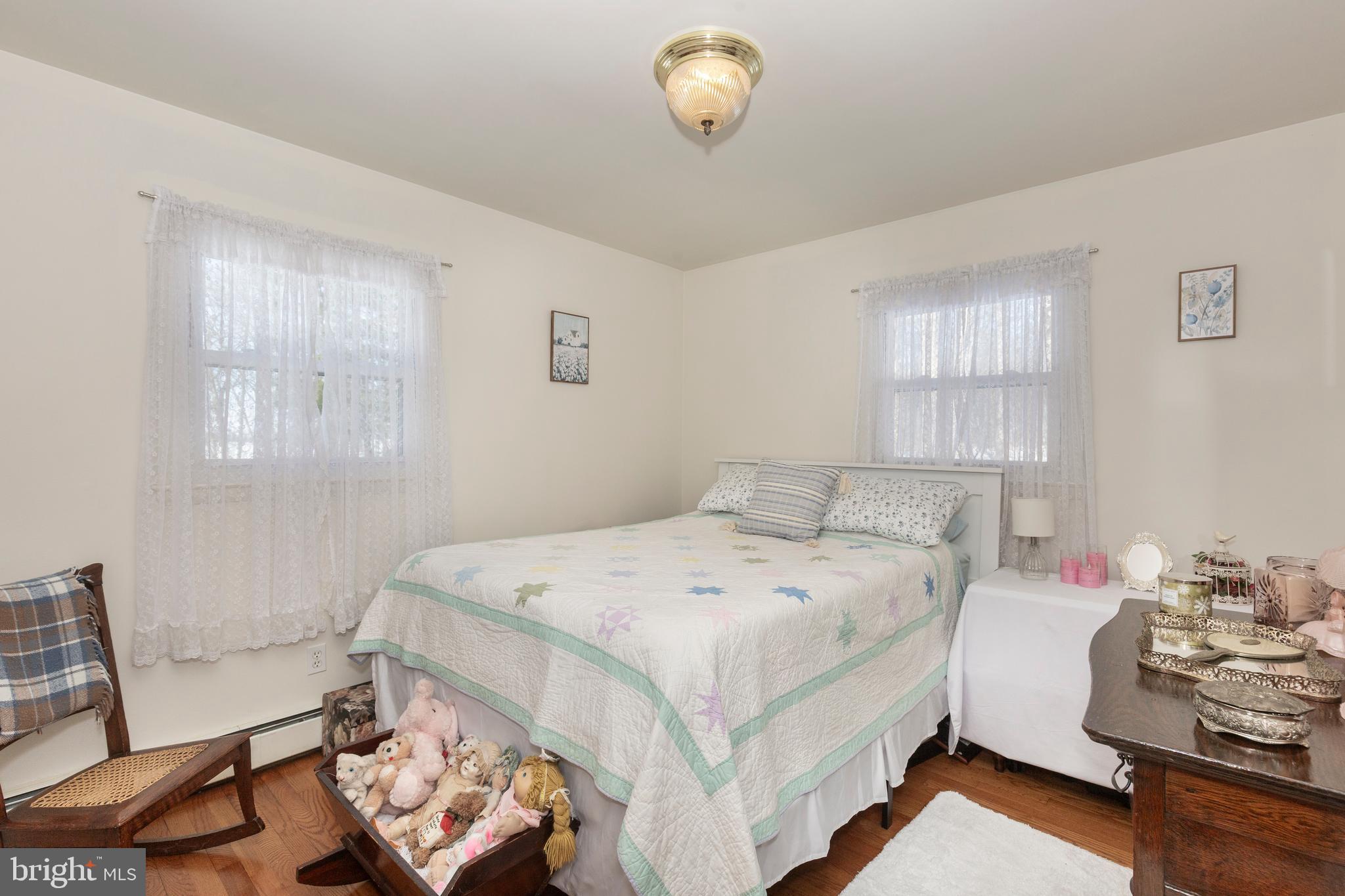 3820 Kump Station Road Taneytown, MD 21787 - Photo 22 of 59 a bedroom with a bed and window