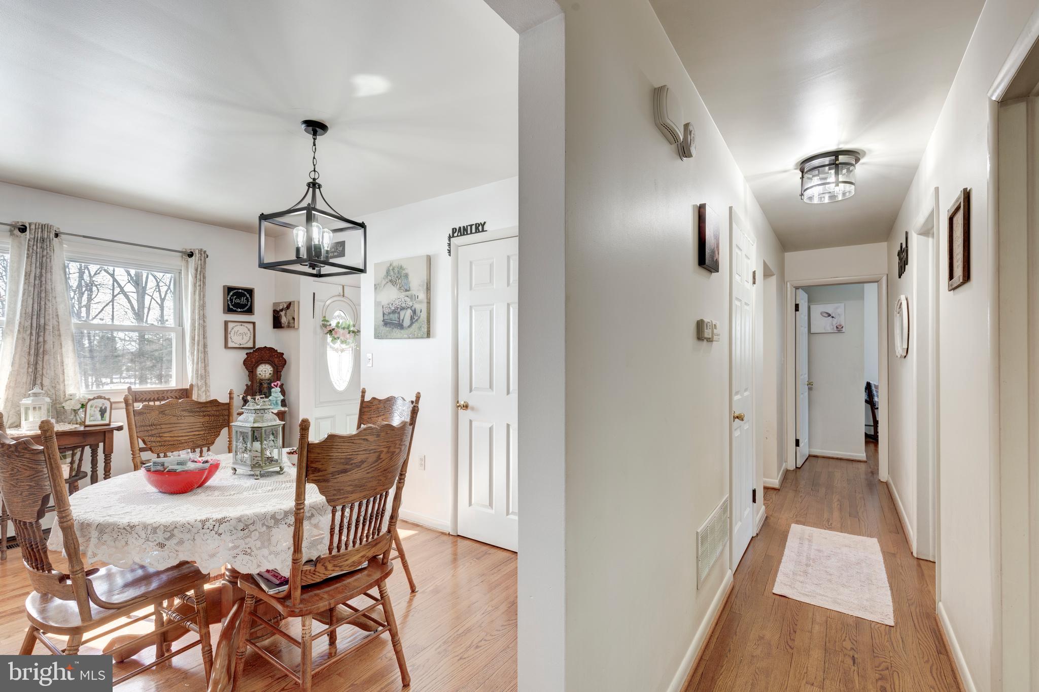3820 Kump Station Road Taneytown, MD 21787 - Photo 10 of 59 a view of a dining room with furniture window and wooden floor
