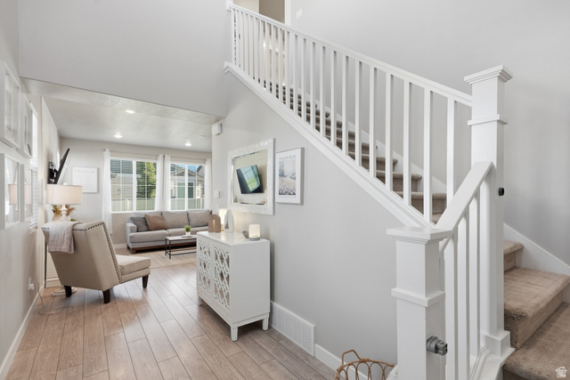 3244 West 1670th Street North Provo, UT 84601 - Photo 7 of 56 Staircase featuring white balusters and newel posts with carpeted treads