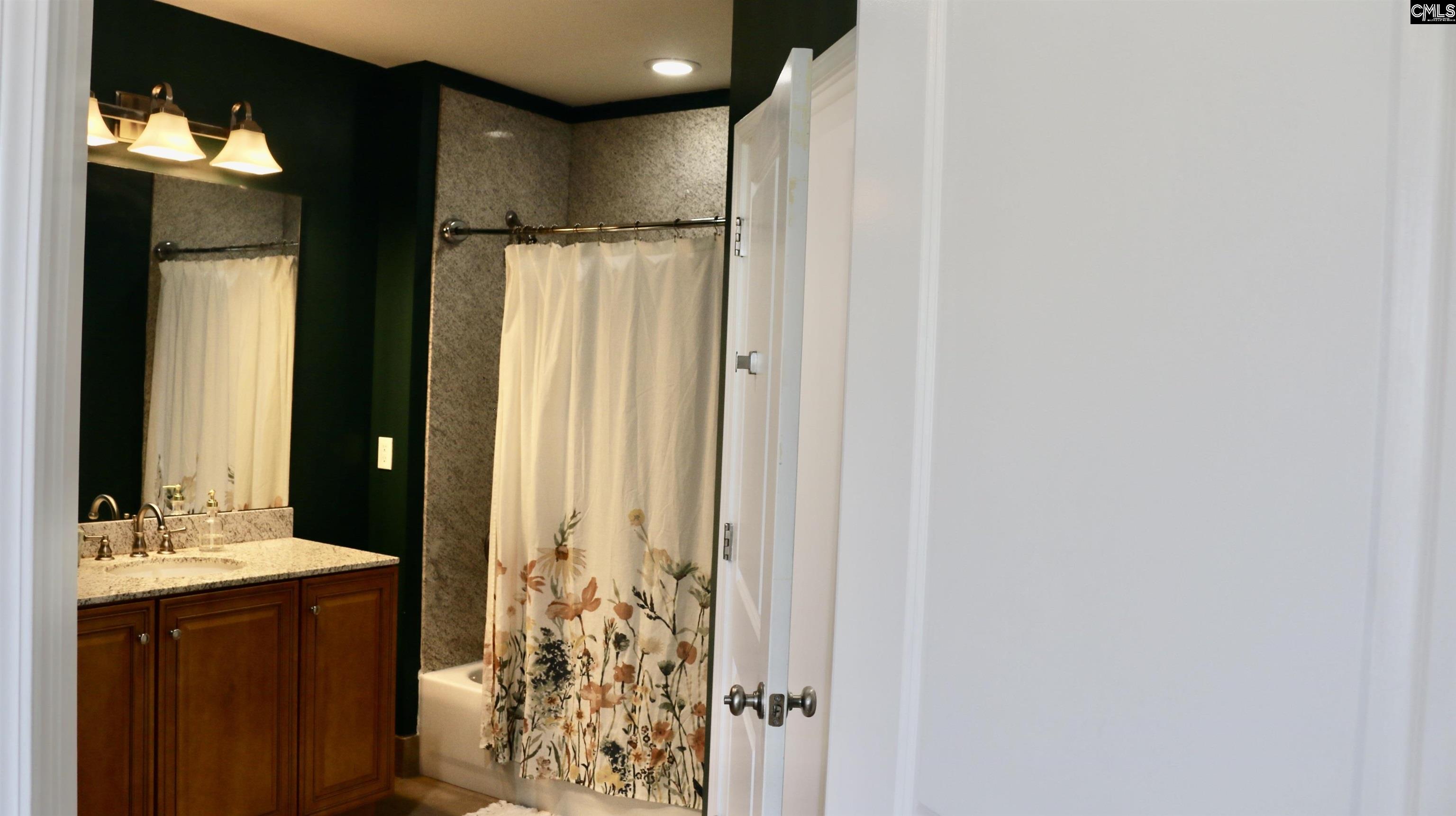 601 Main Street, Unit 323 Columbia, SC 29201 - Photo 41 of 68 a bathroom with a double vanity sink and shower