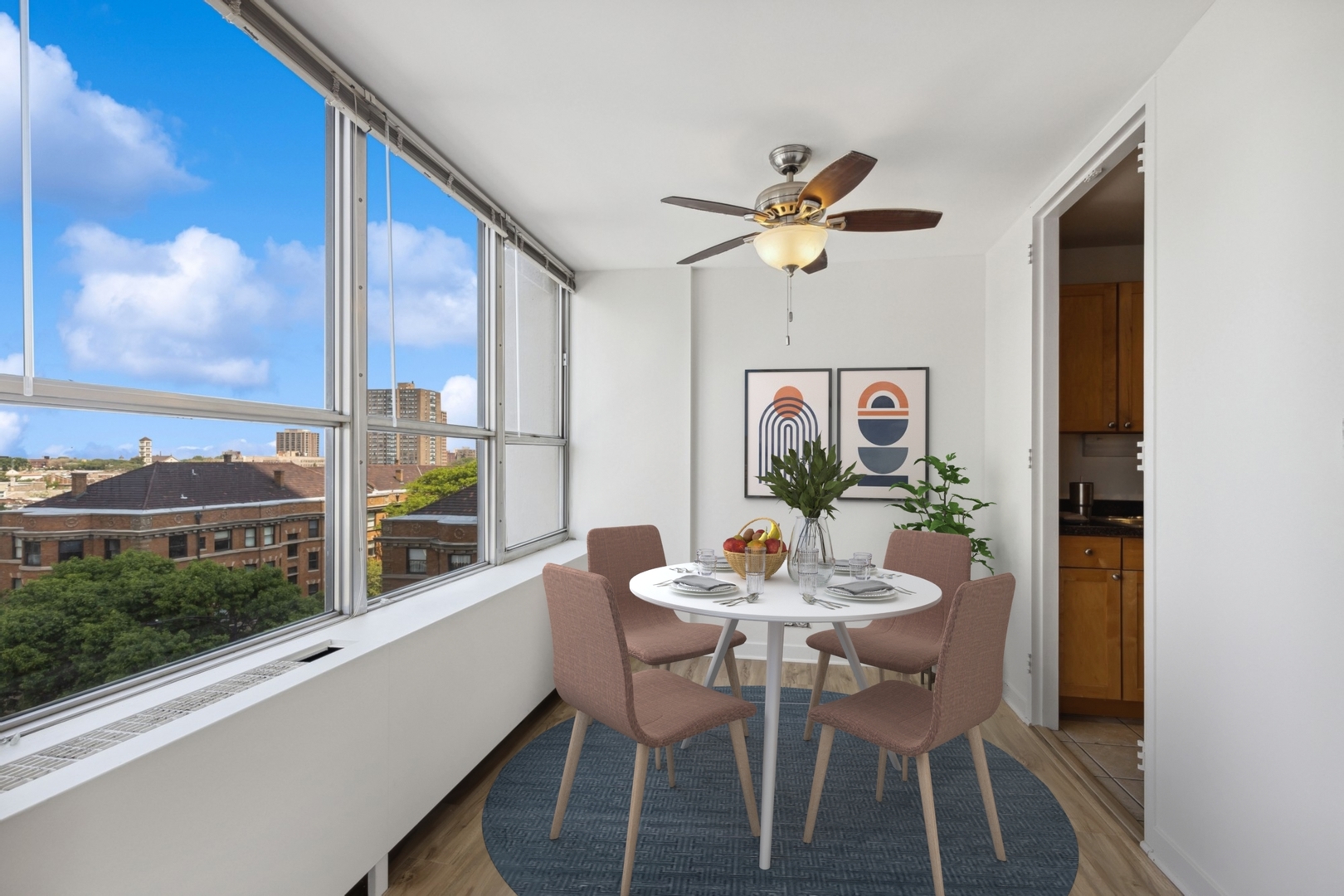 655 West Irving Park Road, Unit 617 Chicago, IL 60613 - Photo 11 of 33 a view of a dining room with furniture window and wooden floor