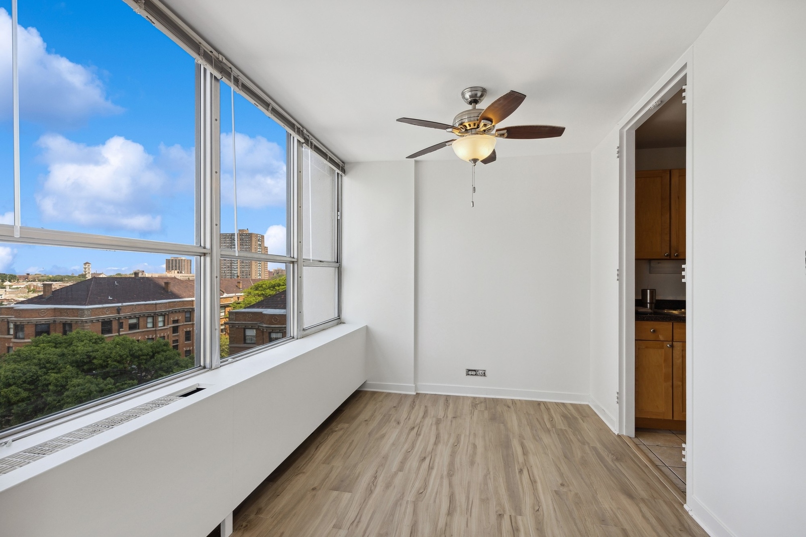 655 West Irving Park Road, Unit 617 Chicago, IL 60613 - Photo 12 of 33 a view of a balcony with a ceiling fan
