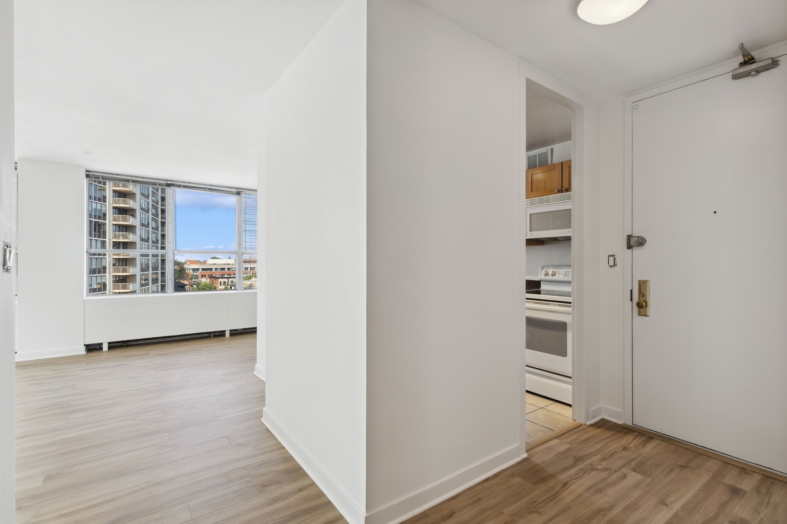 655 West Irving Park Road, Unit 617 Chicago, IL 60613 - Photo 15 of 33 a view of wooden floor and windows in a room
