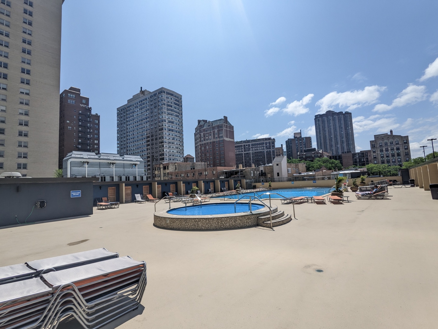 655 West Irving Park Road, Unit 617 Chicago, IL 60613 - Photo 31 of 33 a swimming pool with outdoor seating and city view