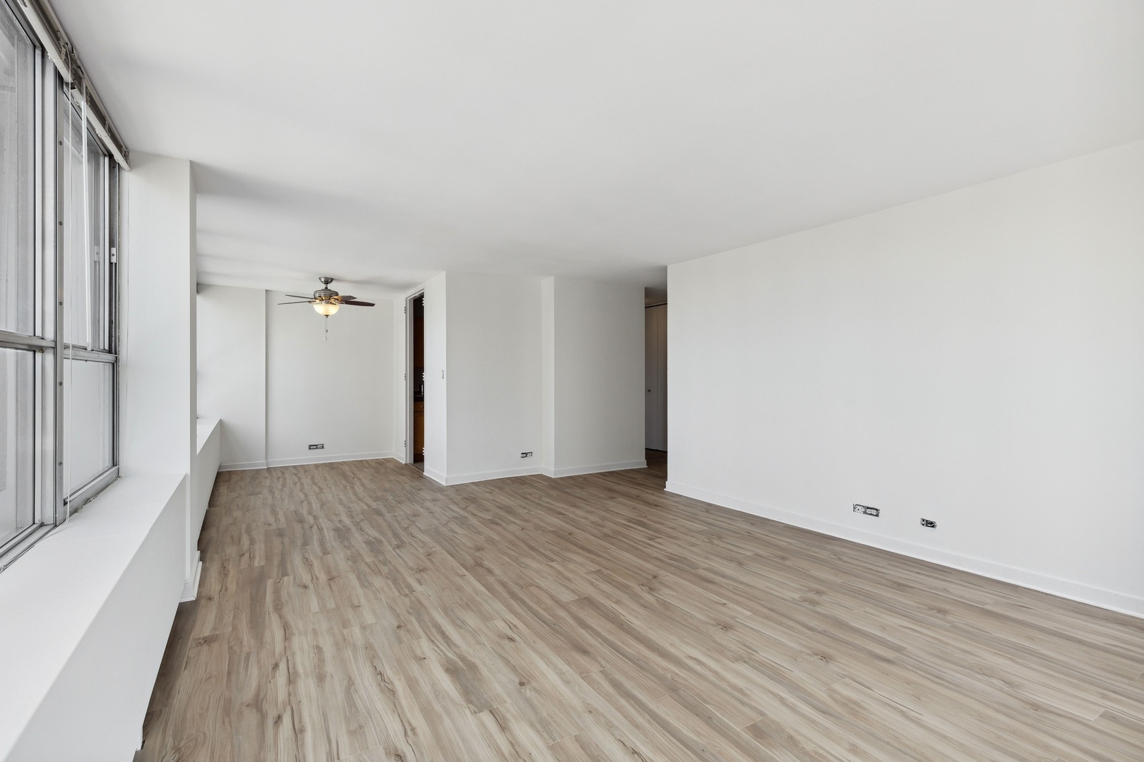 655 West Irving Park Road, Unit 617 Chicago, IL 60613 - Photo 10 of 33 a view of a livingroom with wooden floor