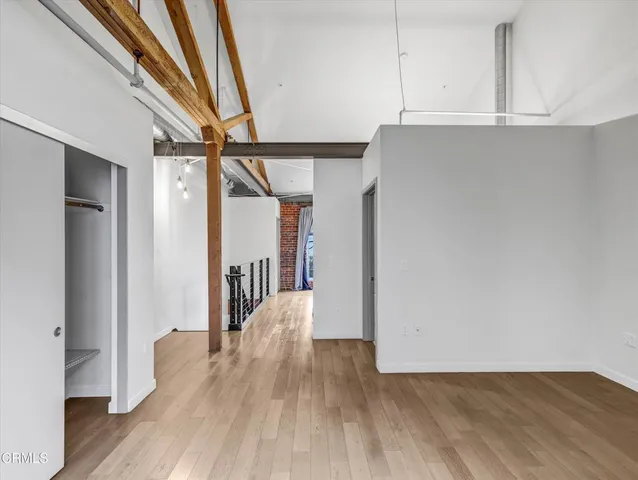 a view of hallway with wooden floor