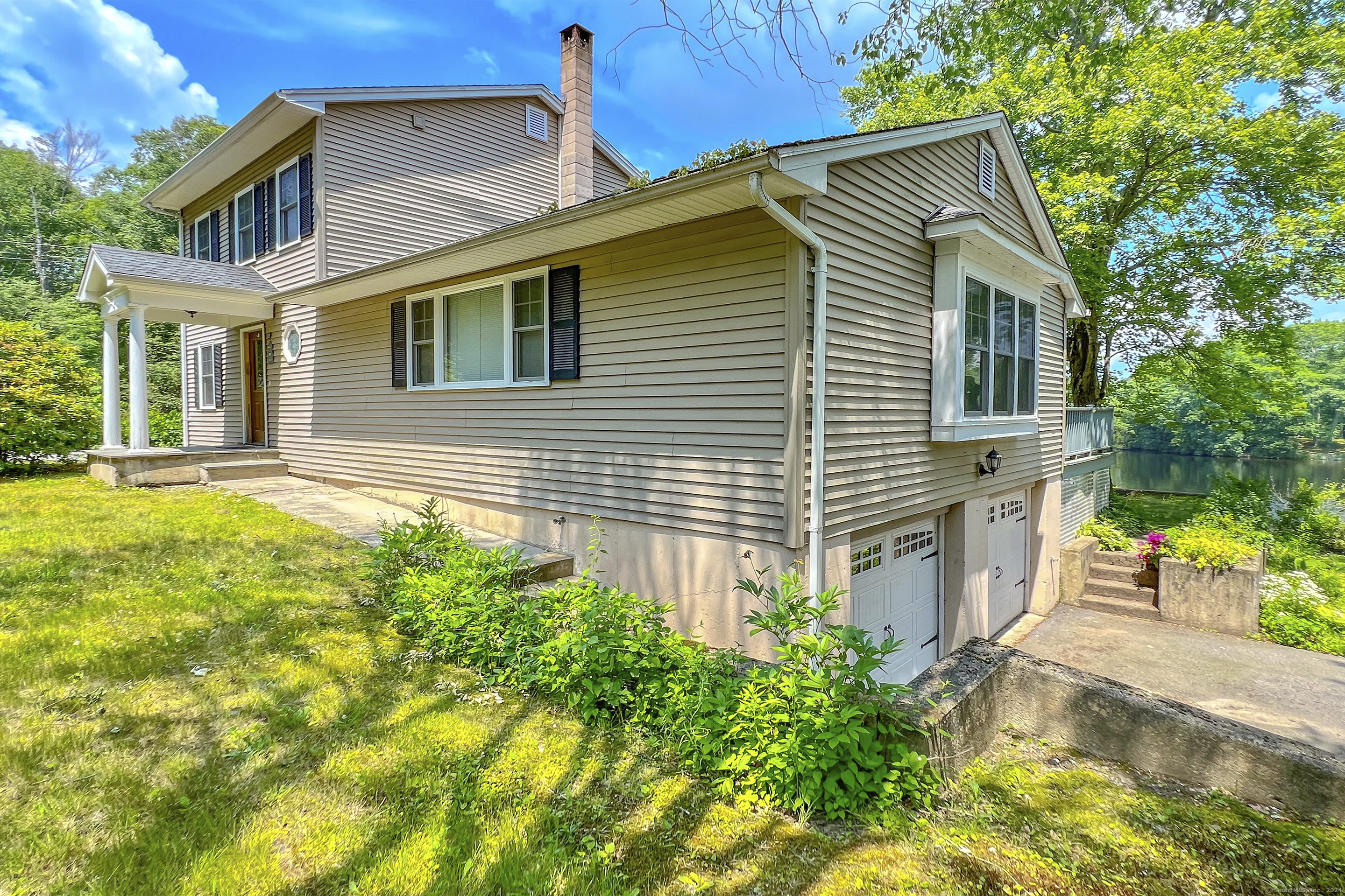 92 Catlin Road Harwinton, CT 06791 - Photo 1 of 1 a front view of a house with a yard