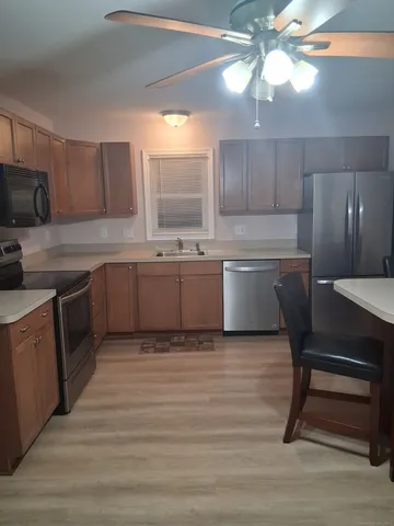 a kitchen with a sink cabinets and window