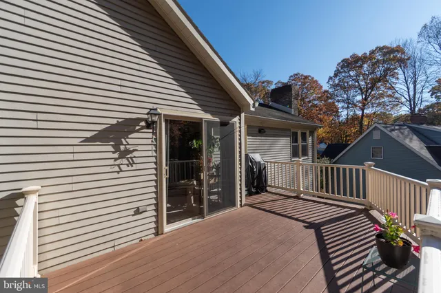 a view of a house with wooden deck
