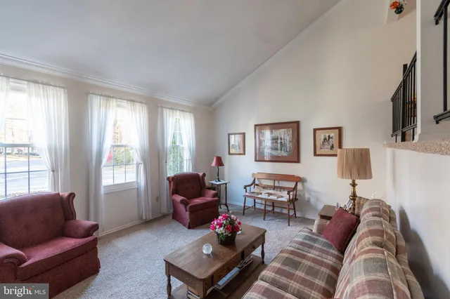 a living room with furniture or couch and a window