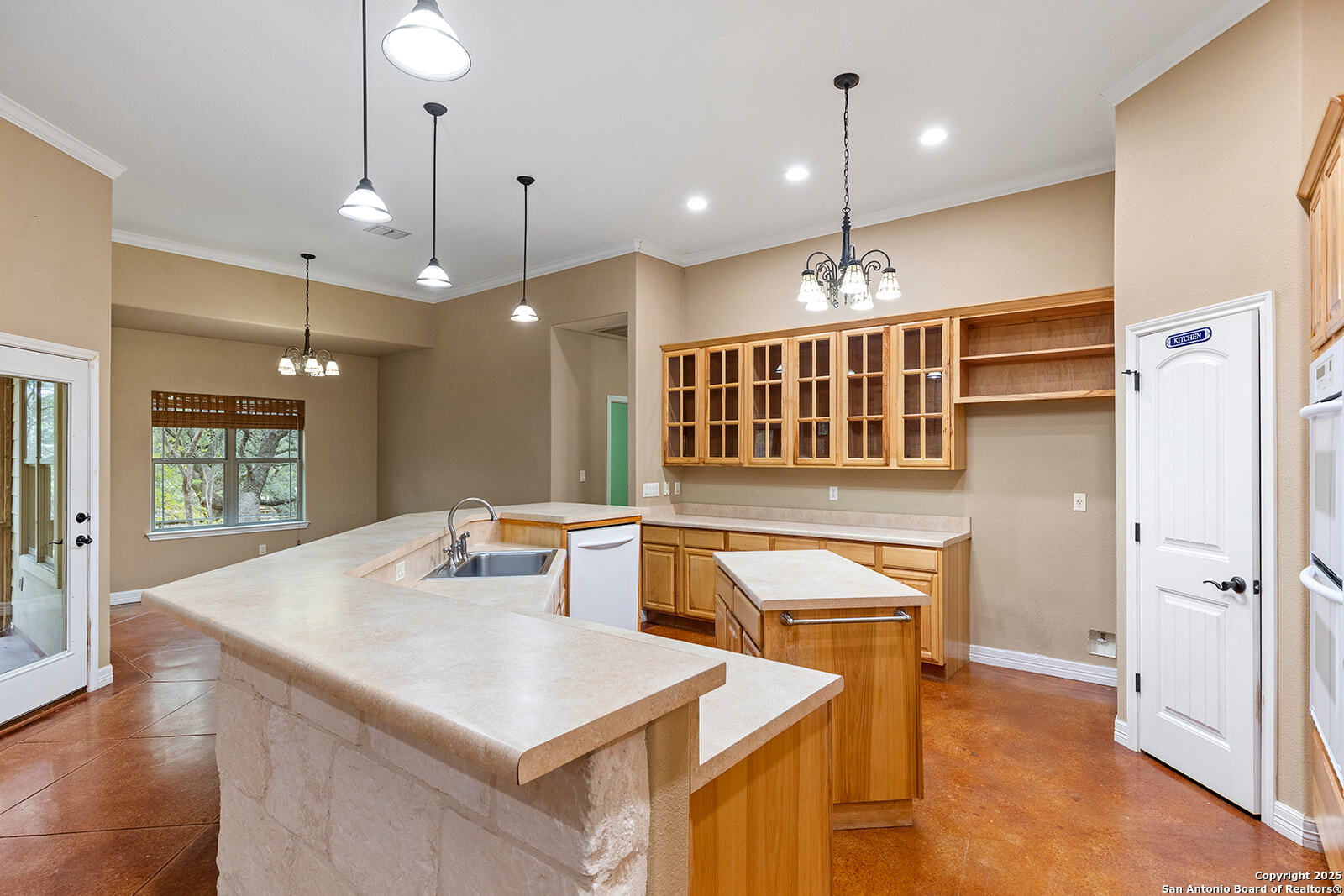 632 Copper Rim Spring Branch, TX 78070 - Photo 14 of 45 a kitchen with a refrigerator a sink and chairs