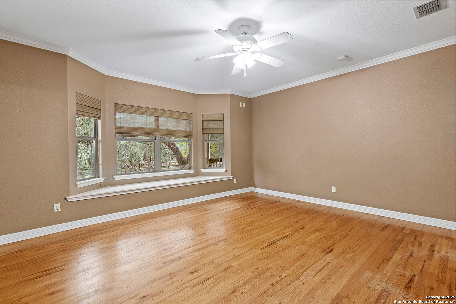 632 Copper Rim Spring Branch, TX 78070 - Photo 22 of 45 a view of an empty room with a window and wooden floor