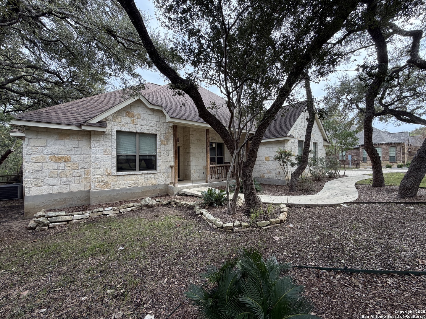 632 Copper Rim Spring Branch, TX 78070 - Photo 3 of 45 a front view of a house with garden