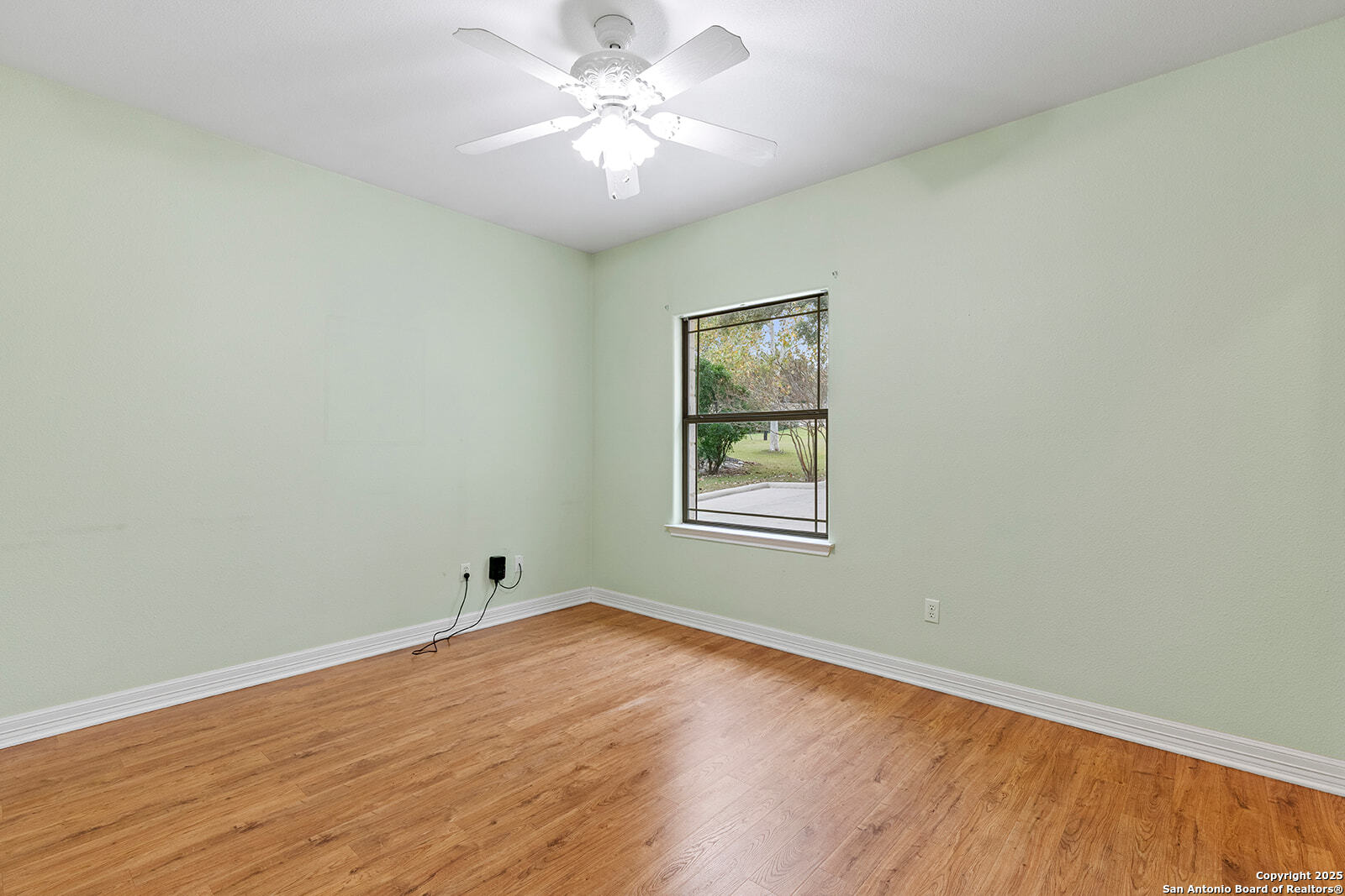 632 Copper Rim Spring Branch, TX 78070 - Photo 34 of 45 a view of empty room with wooden floor and fan