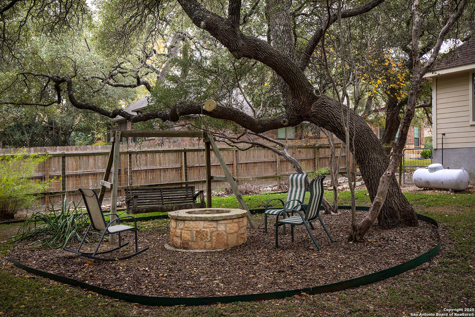 632 Copper Rim Spring Branch, TX 78070 - Photo 43 of 45 a view of a backyard with plants and a fountain