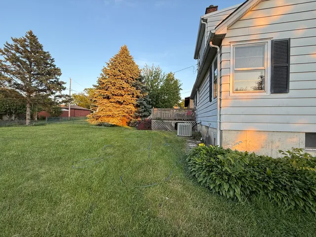 a backyard of a house with lots of green space