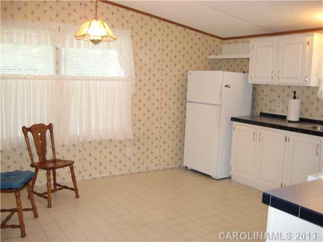 3915 Berry Hill Road Edgemoor, SC 29712 - Photo 5 of 16 a view of kitchen with furniture and window