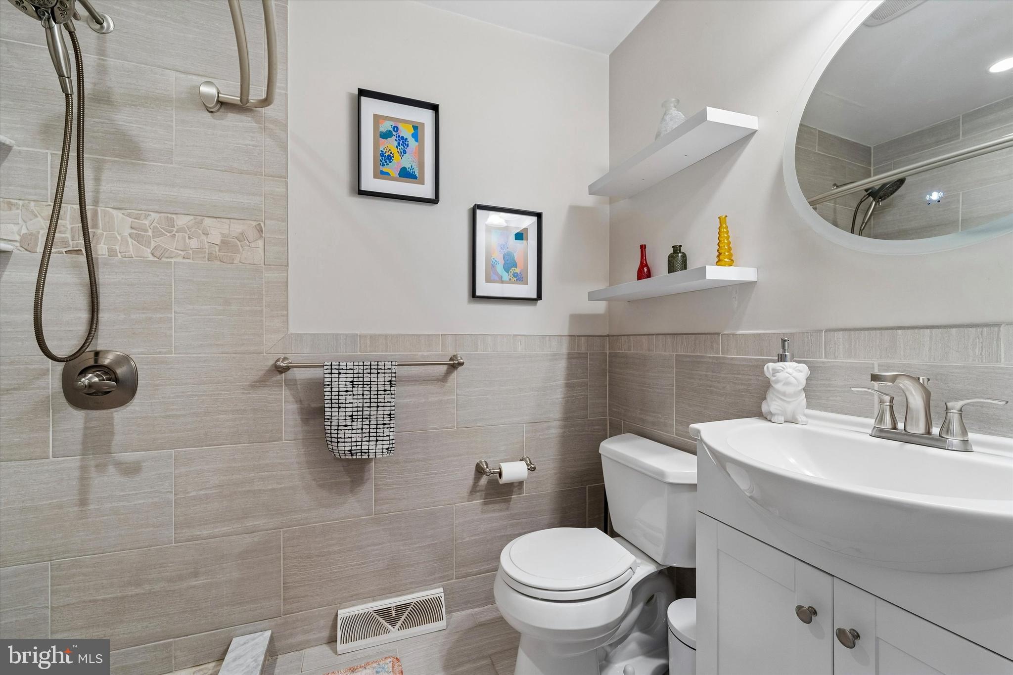 19 Juniper Road Havertown, PA 19083 - Photo 18 of 24 a bathroom with a toilet sink and mirror