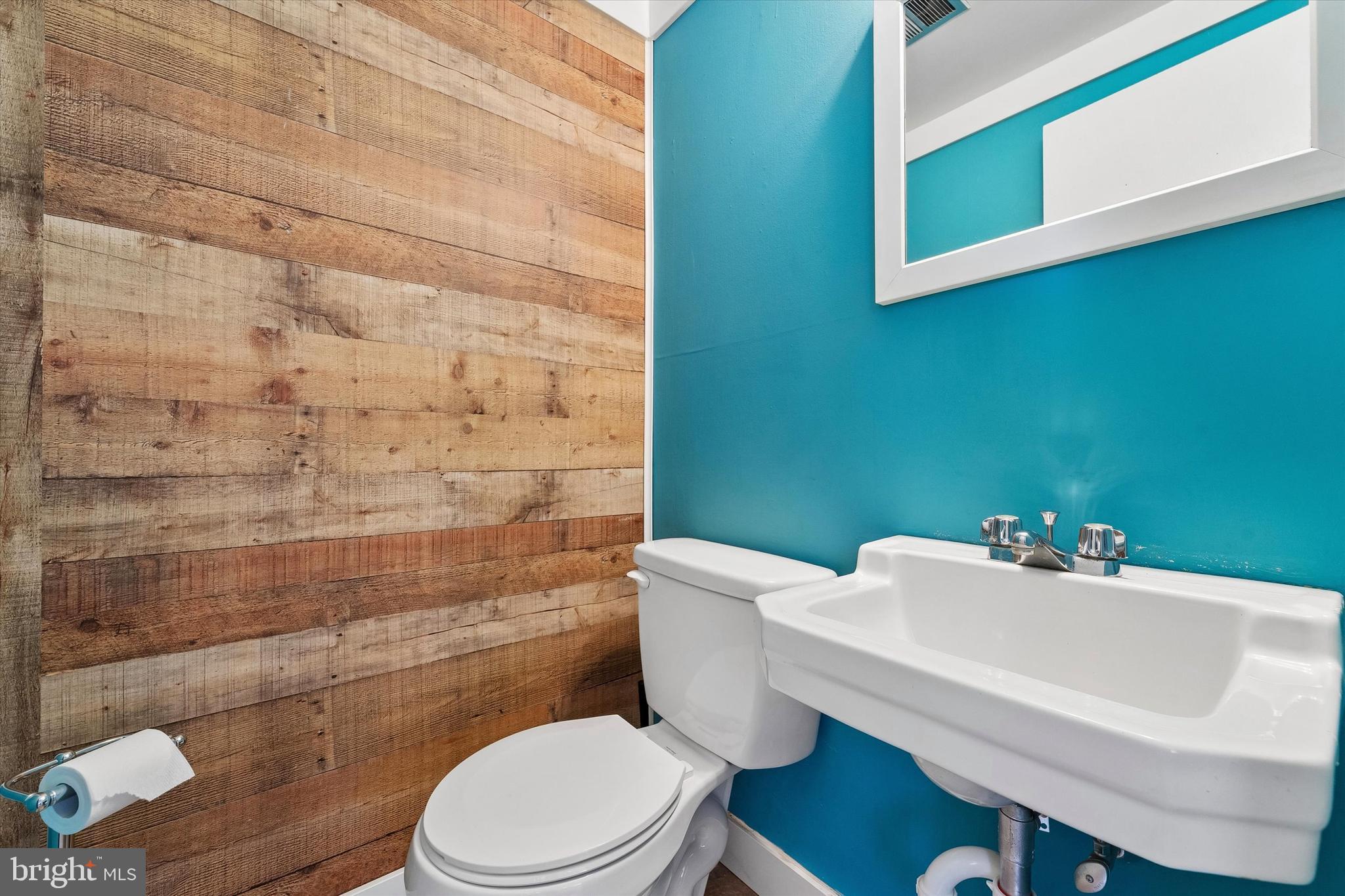 19 Juniper Road Havertown, PA 19083 - Photo 21 of 24 a bathroom with a sink a toilet and a mirror