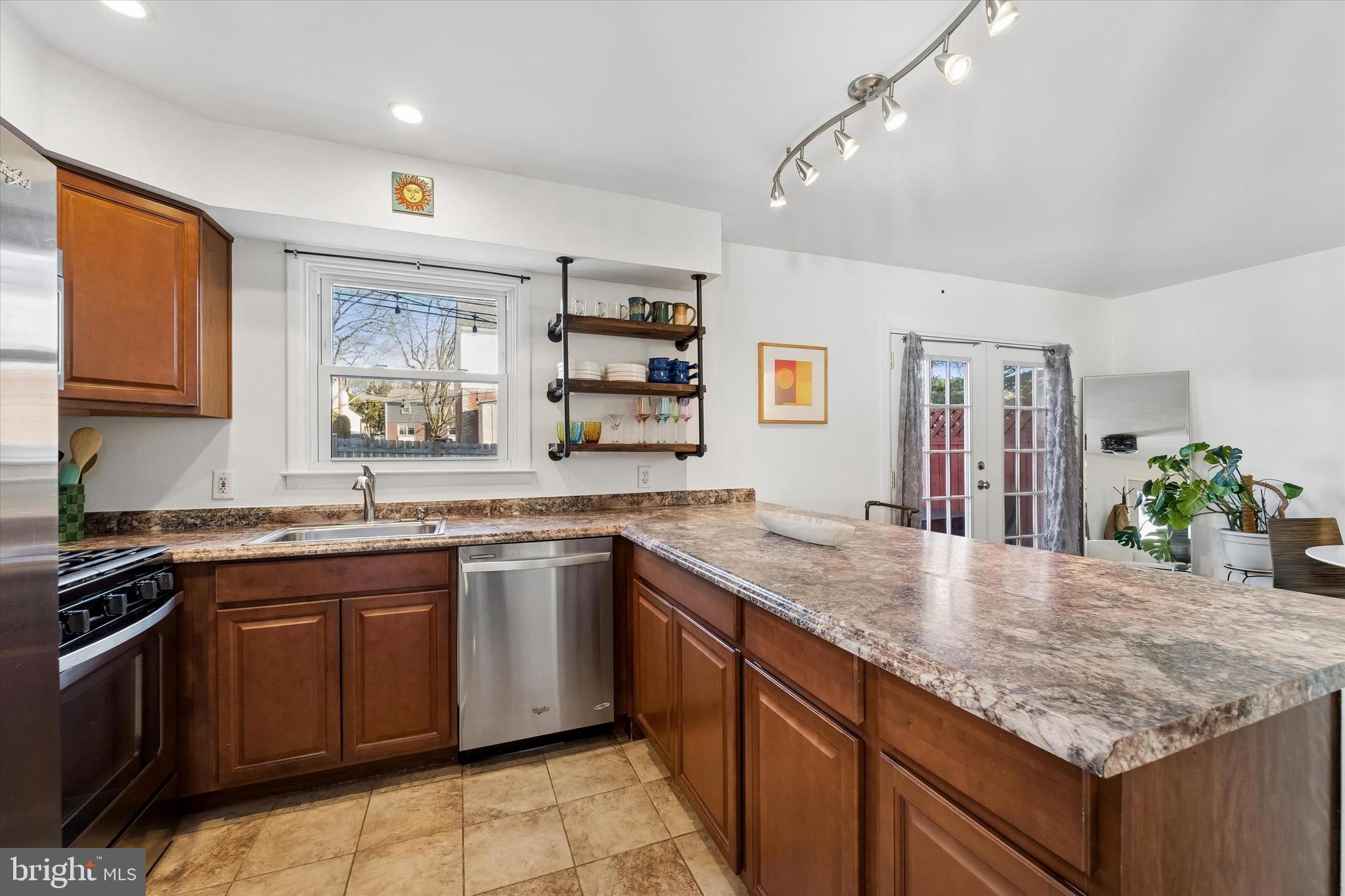 19 Juniper Road Havertown, PA 19083 - Photo 9 of 24 a kitchen with stainless steel appliances granite countertop sink stove and refrigerator