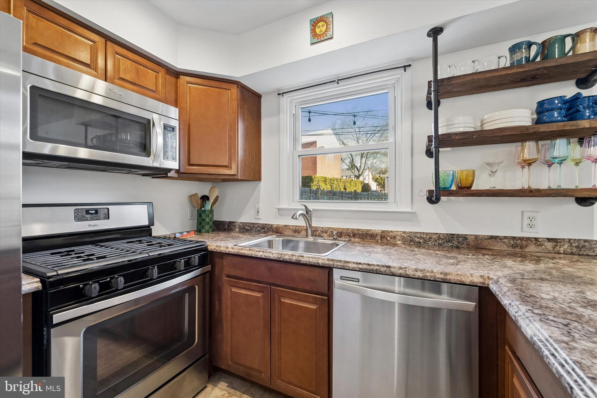 19 Juniper Road Havertown, PA 19083 - Photo 10 of 24 a kitchen with stainless steel appliances granite countertop a stove microwave and sink